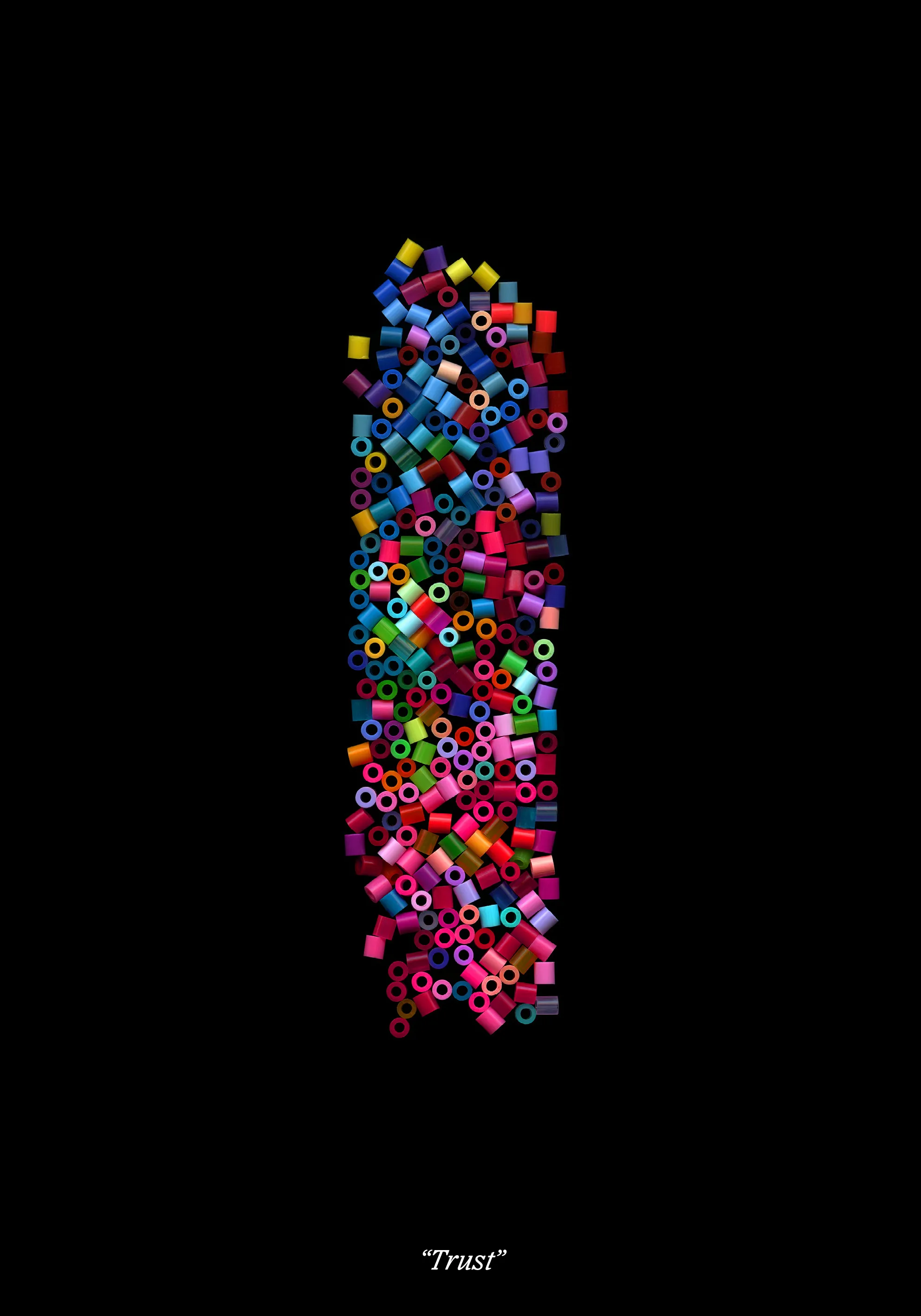Loose fuse beads stacked into a tall upright column on black, titled “Trust”