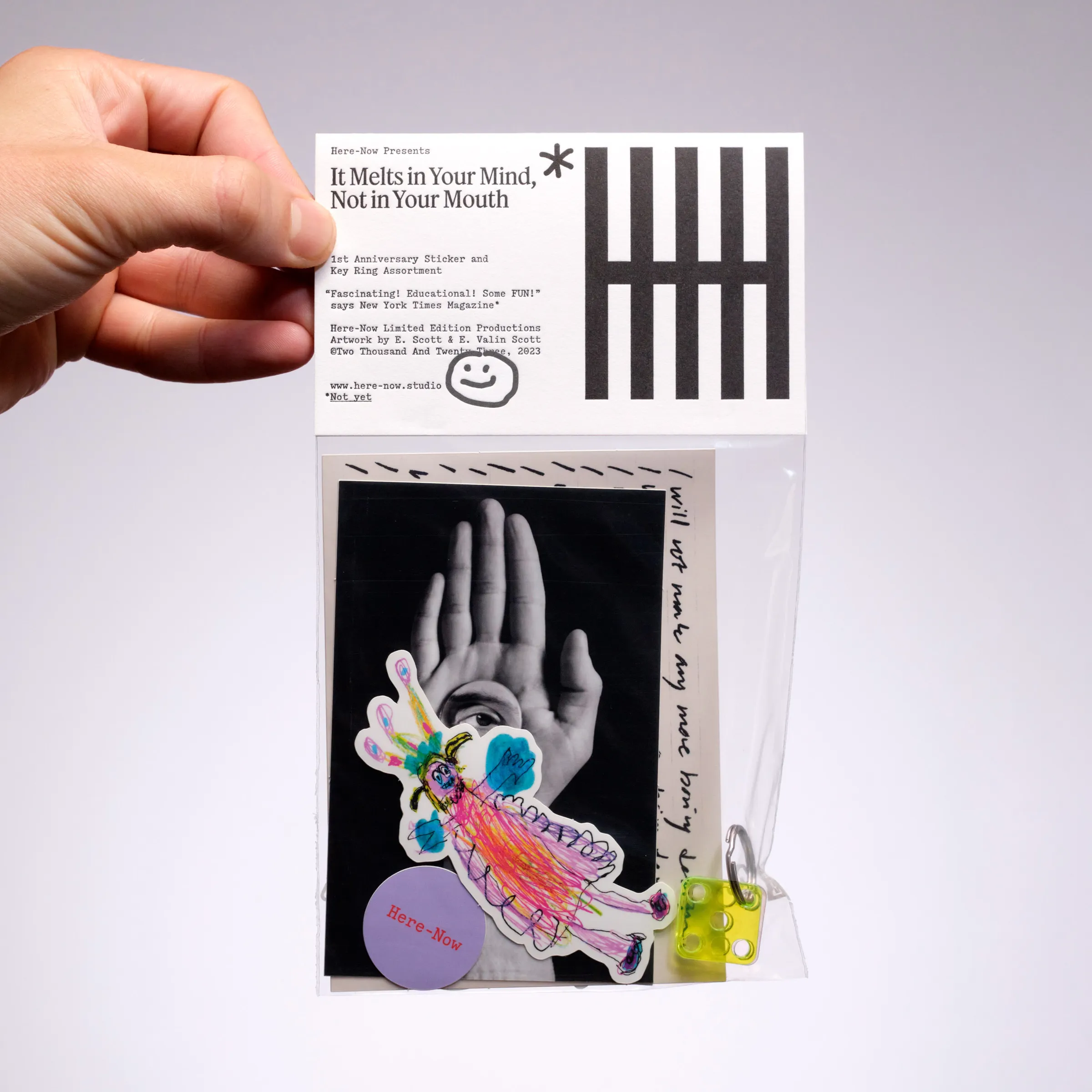 Hand holding a bagged pack titled “It Melts in Your Mind, Not in Your Mouth”, with a child’s-drawing sticker