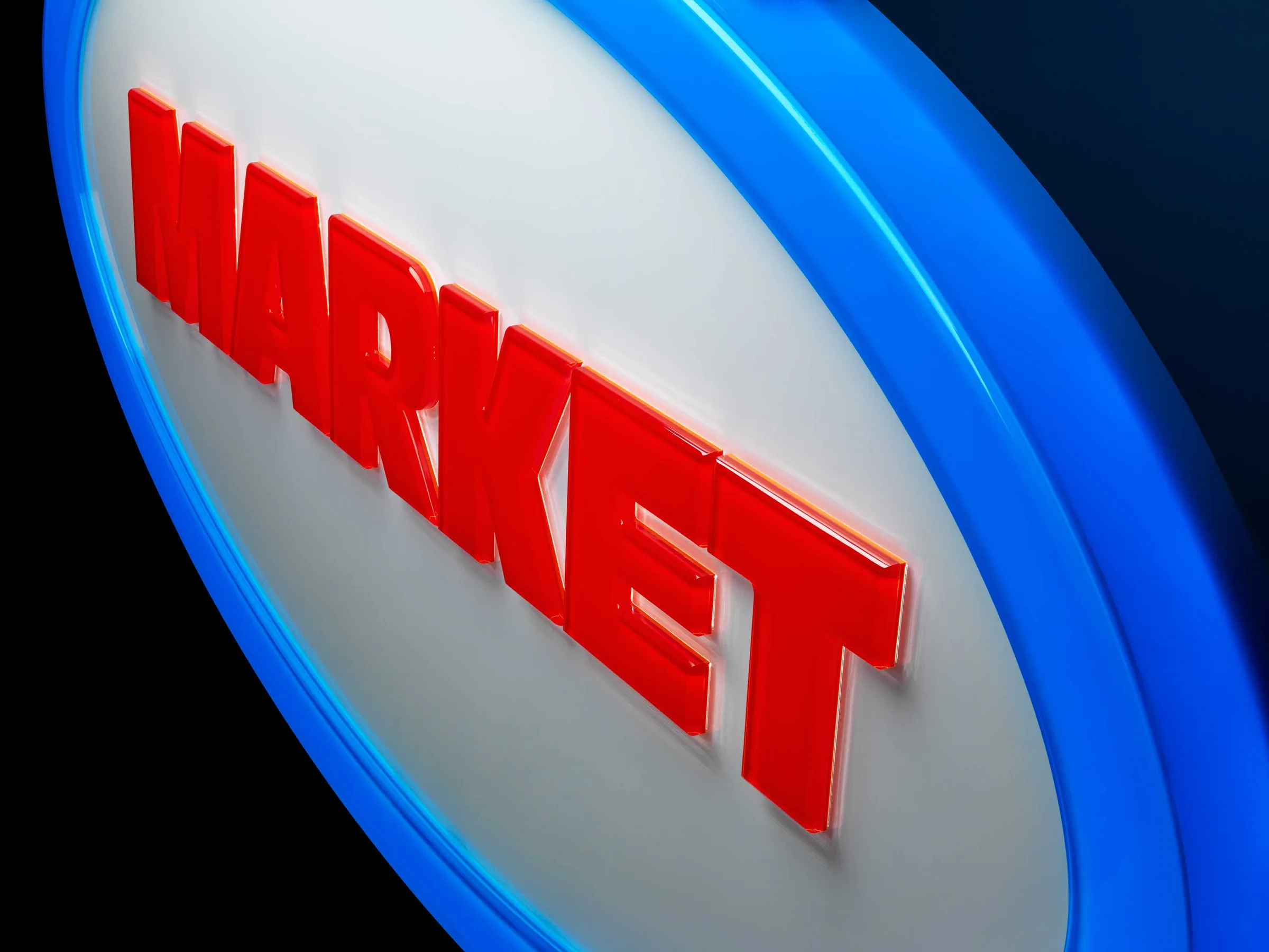 Close-up of an oval lightbox sign: red “MARKET” on white inside a blue ring