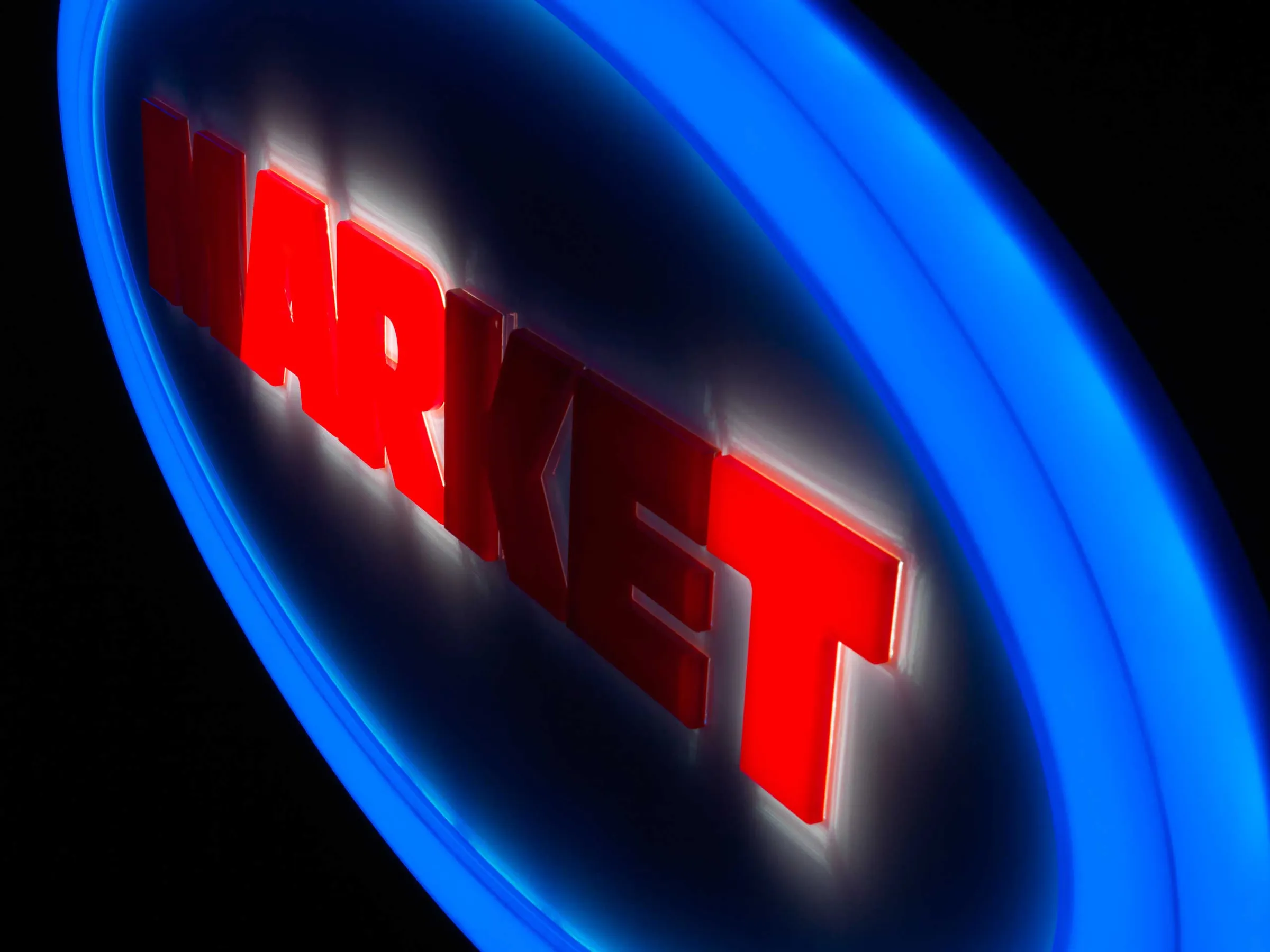 The same sign with only A, R and T lit, spelling “ART” within “MARKET”