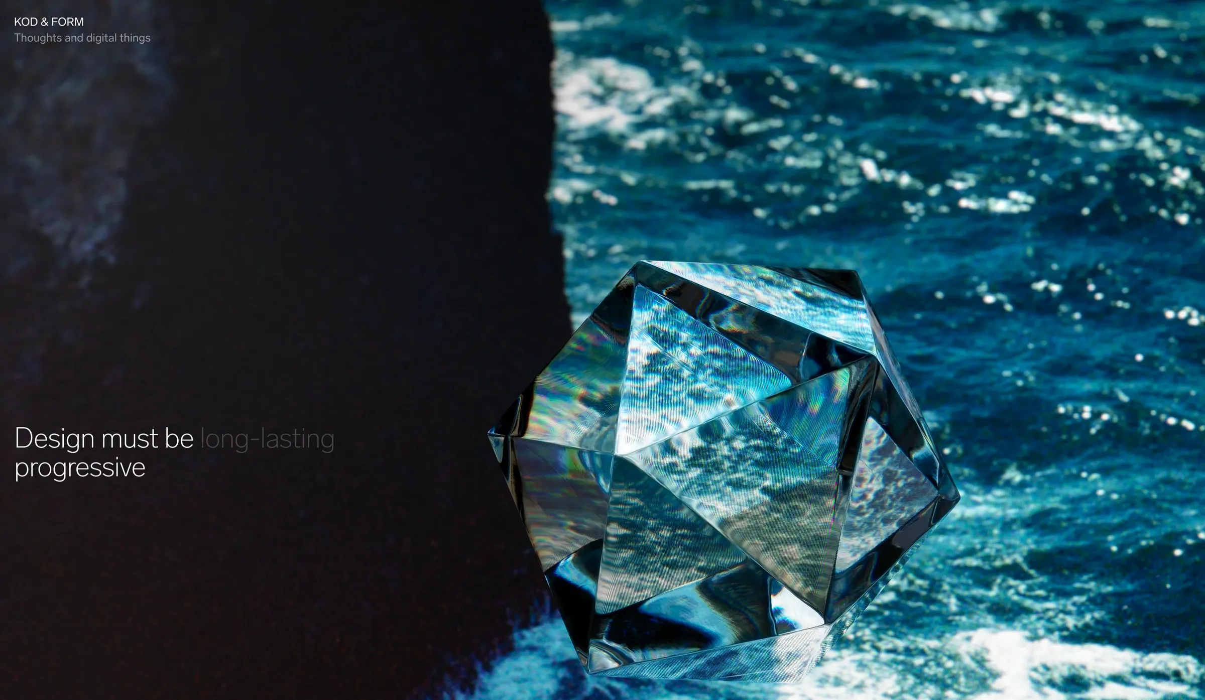 Glass icosahedron over a dark sea, next to the line “Design must be long-lasting progressive”